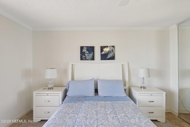 3360 Ocean Shore Blvd Unit 3070, Ormond Beach, FL 32176 - bedroom featuring crown molding, a textured ceiling, and baseboards