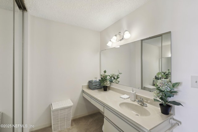 3360 Ocean Shore Blvd Unit 3070, Ormond Beach, FL 32176 - bathroom featuring a textured ceiling and vanity