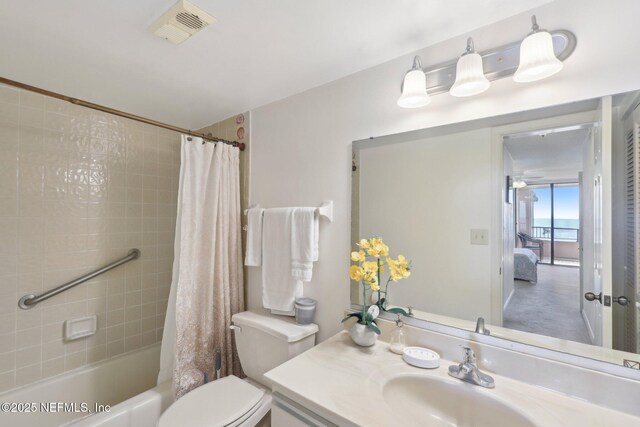 3360 Ocean Shore Blvd Unit 3070, Ormond Beach, FL 32176 - full bath featuring vanity, toilet, shower / tub combo with curtain, and ensuite bath
