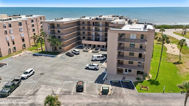 3360 Ocean Shore Blvd Unit 3070, Ormond Beach, FL 32176 - view of apartment building / complex featuring uncovered parking and a water view