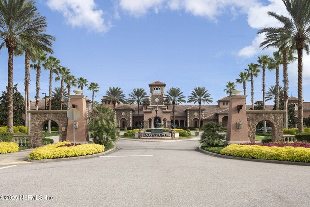 263 Forest Spring Dr, Ponte Vedra, FL 32081 - view of asphalt street featuring curbs, street lighting, and traffic signs