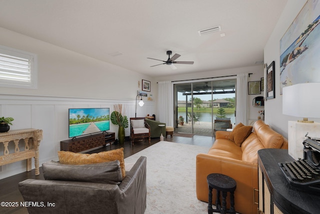 263 Forest Spring Dr, Ponte Vedra, FL 32081 - living area with ceiling fan, wood finished floors, a decorative wall, and wainscoting