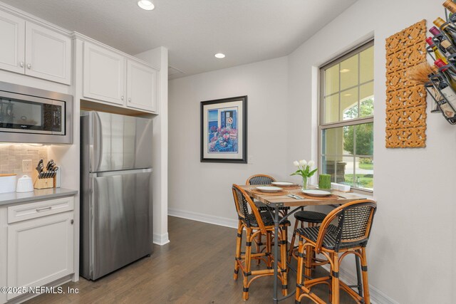 263 Forest Spring Dr, Ponte Vedra, FL 32081 - dining room featuring baseboards, recessed lighting, and dark wood-style flooring