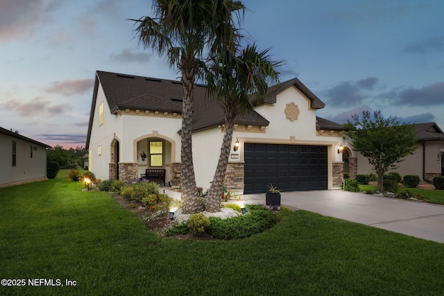 263 Forest Spring Dr, Ponte Vedra, FL 32081 - mediterranean / spanish-style home with stucco siding, stone siding, concrete driveway, a front lawn, and a garage