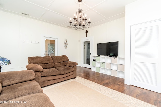 148 N 4th St, Macclenny, FL 32063 - living room featuring a chandelier, wood finished floors, and coffered ceiling