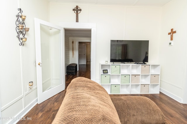 148 N 4th St, Macclenny, FL 32063 - sitting room featuring dark wood-style floors and a decorative wall