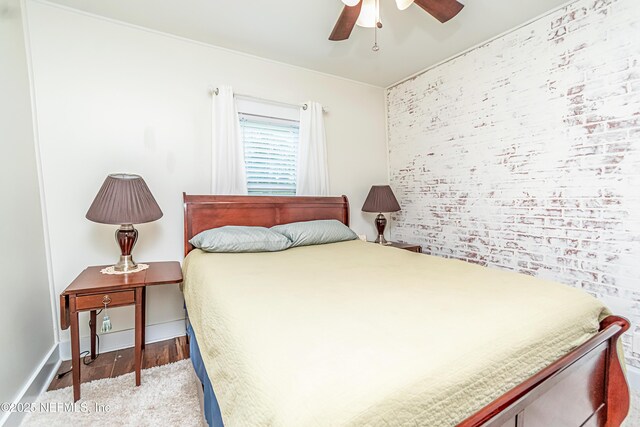 148 N 4th St, Macclenny, FL 32063 - bedroom with light wood finished floors, a ceiling fan, and baseboards