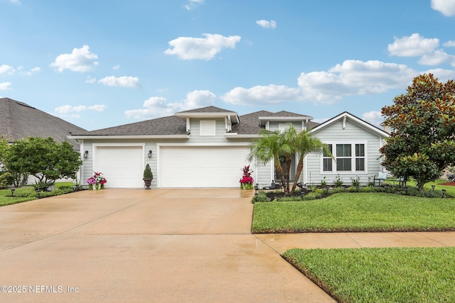 284 Queen Victoria Ave, Saint Johns, FL 32259 - view of front of home featuring a front lawn, driveway, a garage, and a shingled roof