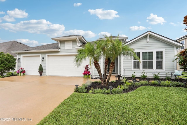 284 Queen Victoria Ave, Saint Johns, FL 32259 - view of front of home with concrete driveway, a garage, and a front lawn