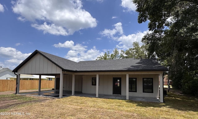 37280 New Oak St, Hilliard, FL 32046 - back of property featuring board and batten siding, a patio, and roof with shingles