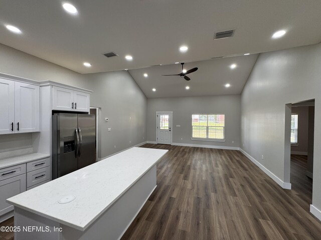 37280 New Oak St, Hilliard, FL 32046 - kitchen with stainless steel fridge with ice dispenser, a ceiling fan, open floor plan, baseboards, and a kitchen island