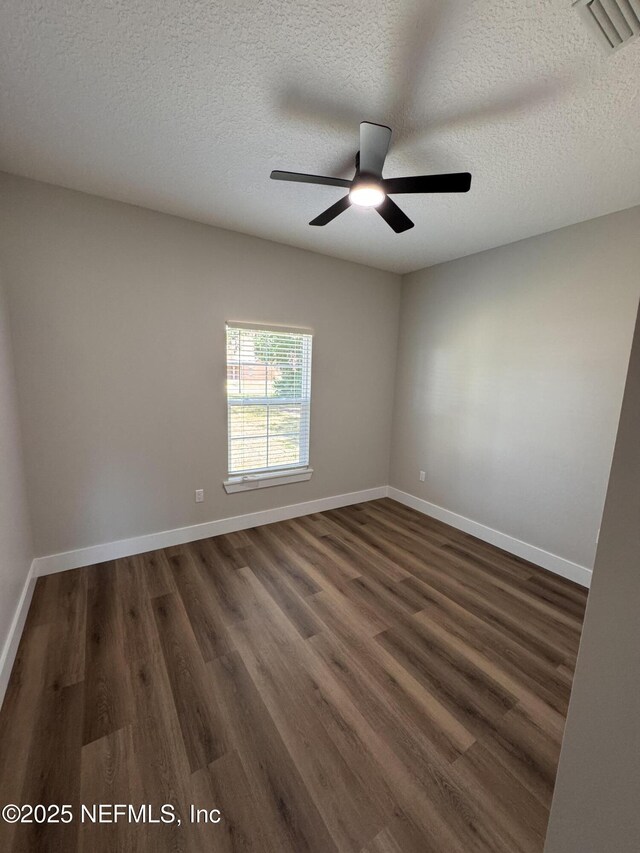 37280 New Oak St, Hilliard, FL 32046 - unfurnished room with ceiling fan, dark wood-type flooring, baseboards, and a textured ceiling