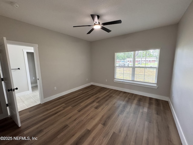 37280 New Oak St, Hilliard, FL 32046 - empty room with ceiling fan, dark wood-type flooring, baseboards, and a smoke detector