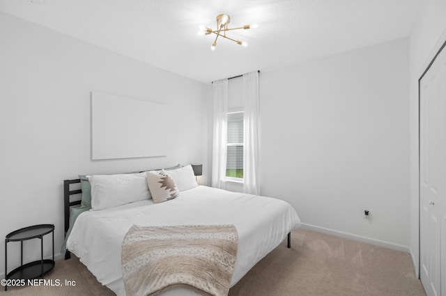 7242 Calamint Ave, Jacksonville, FL 32219 - bedroom featuring carpet floors, a chandelier, baseboards, and a closet