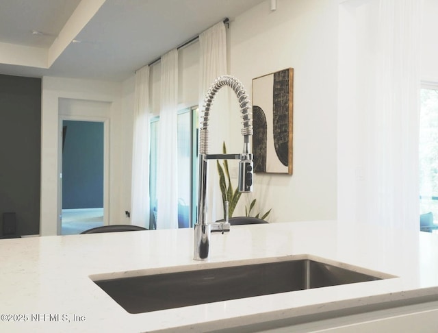 7242 Calamint Ave, Jacksonville, FL 32219 - kitchen view of a sink and light stone counters