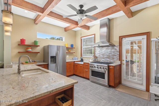 24 Sevilla St, Saint Augustine, FL 32084 - kitchen featuring open shelves, appliances with stainless steel finishes, wall chimney range hood, a sink, and brown cabinetry