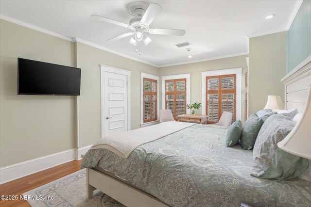 24 Sevilla St, Saint Augustine, FL 32084 - bedroom featuring wood finished floors, baseboards, crown molding, a ceiling fan, and recessed lighting