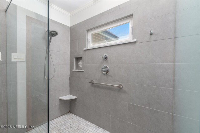 24 Sevilla St, Saint Augustine, FL 32084 - bathroom with crown molding and a tile shower