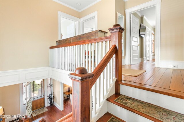 24 Sevilla St, Saint Augustine, FL 32084 - staircase featuring ornamental molding and wood finished floors
