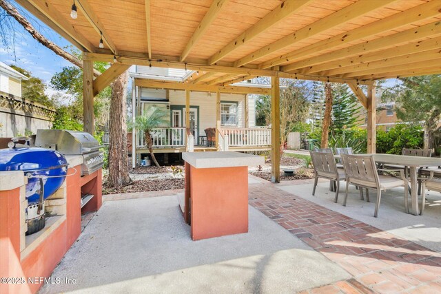 24 Sevilla St, Saint Augustine, FL 32084 - view of patio / terrace with outdoor dining space and area for grilling