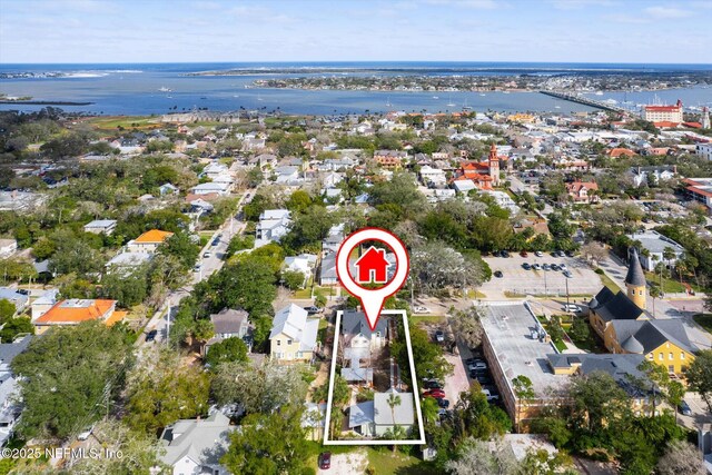 24 Sevilla St, Saint Augustine, FL 32084 - aerial view of property's location with a large body of water, property parcel outlined, and nearby suburban area