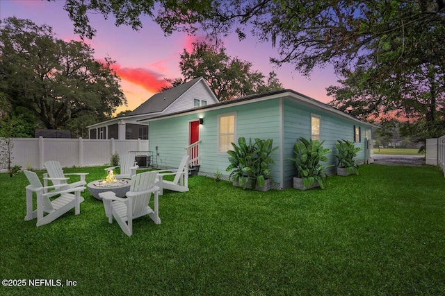 619 S 10th St, Fernandina Beach, FL 32034 - rear view of house with a fire pit and entry steps