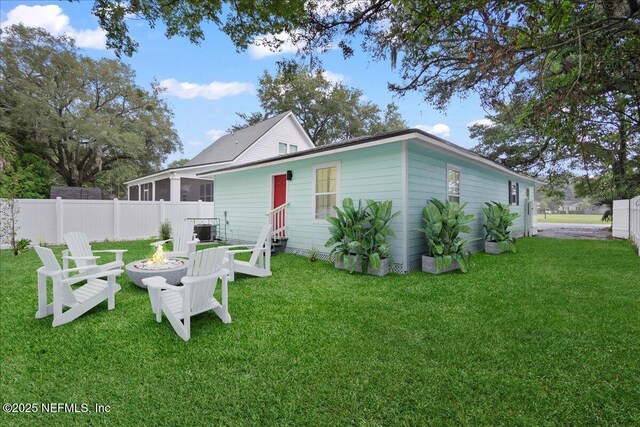619 S 10th St, Fernandina Beach, FL 32034 - back of house featuring a fire pit and entry steps