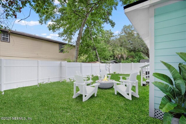619 S 10th St, Fernandina Beach, FL 32034 - view of yard with an outdoor fire pit