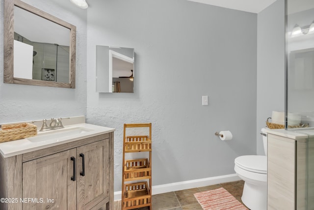 1113 Lee Rd, Jacksonville, FL 32225 - bathroom featuring toilet, baseboards, vanity, a shower with shower door, and tile patterned flooring