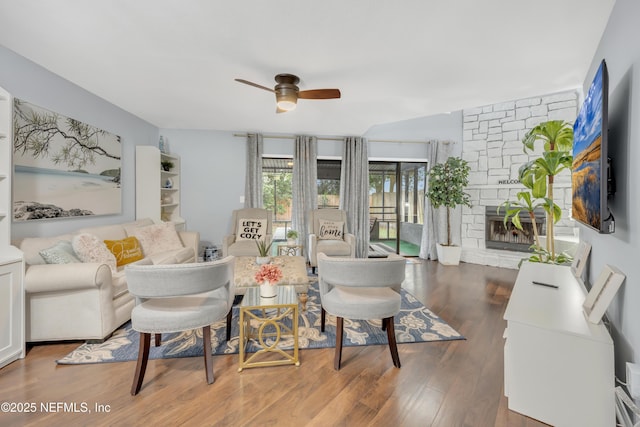 1113 Lee Rd, Jacksonville, FL 32225 - living area with ceiling fan, wood finished floors, and a stone fireplace