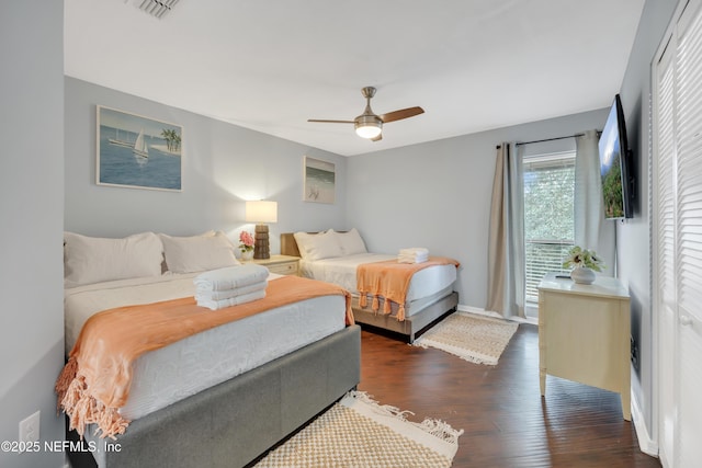 1113 Lee Rd, Jacksonville, FL 32225 - bedroom with dark wood finished floors, baseboards, and ceiling fan