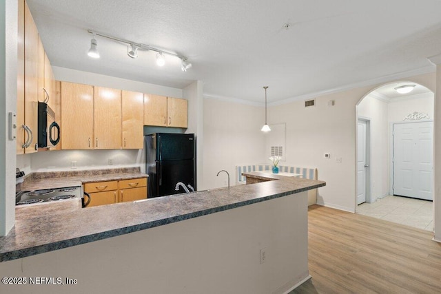 12700 Bartram Park Blvd Unit 1911, Jacksonville, FL 32258 - kitchen with black appliances, a peninsula, arched walkways, light wood-style flooring, and light brown cabinets