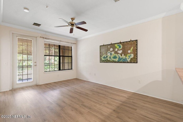 12700 Bartram Park Blvd Unit 1911, Jacksonville, FL 32258 - spare room featuring wood finished floors, ceiling fan, crown molding, and baseboards