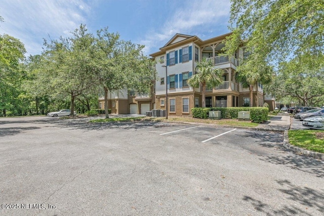 12700 Bartram Park Blvd Unit 1911, Jacksonville, FL 32258 - view of building exterior featuring uncovered parking and central air condition unit