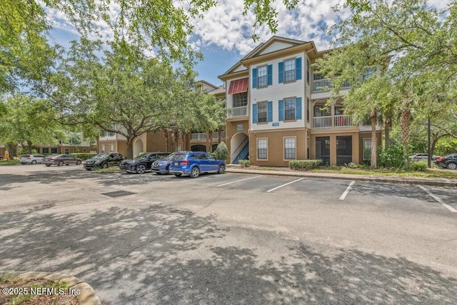 12700 Bartram Park Blvd Unit 1911, Jacksonville, FL 32258 - view of building exterior with uncovered parking and stairway