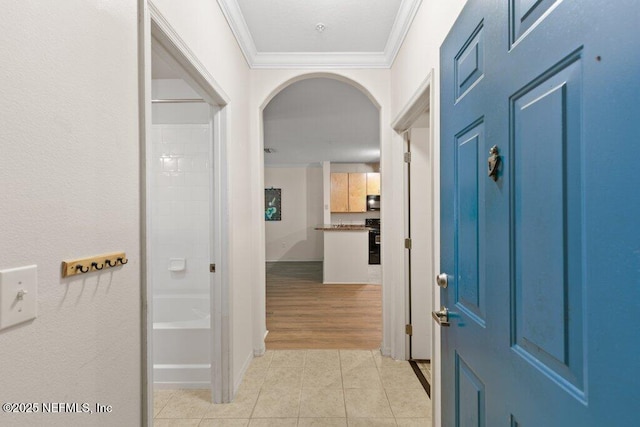 12700 Bartram Park Blvd Unit 1911, Jacksonville, FL 32258 - foyer entrance featuring ornamental molding, arched walkways, light tile patterned floors, and baseboards