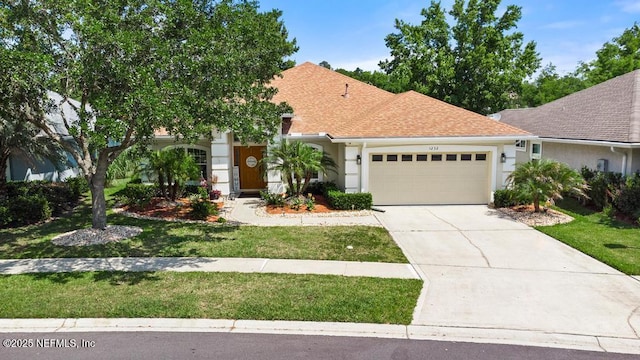 1252 Paradise Pond Rd, Saint Augustine, FL 32092 - view of front facade with a garage, concrete driveway, a front yard, stucco siding, and a shingled roof