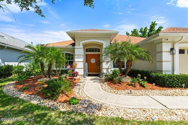 1252 Paradise Pond Rd, Saint Augustine, FL 32092 - entrance to property featuring stucco siding and roof with shingles