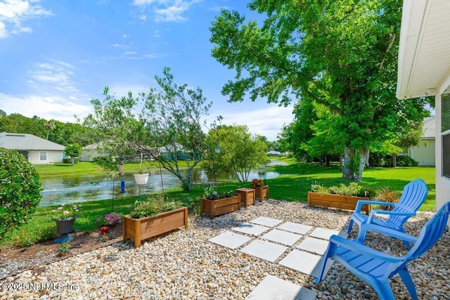 1252 Paradise Pond Rd, Saint Augustine, FL 32092 - view of patio with a garden and a water view