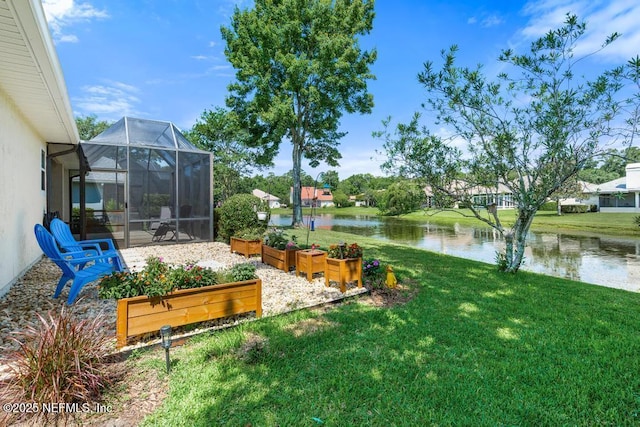 1252 Paradise Pond Rd, Saint Augustine, FL 32092 - view of green lawn featuring a water view, a garden, and glass enclosure