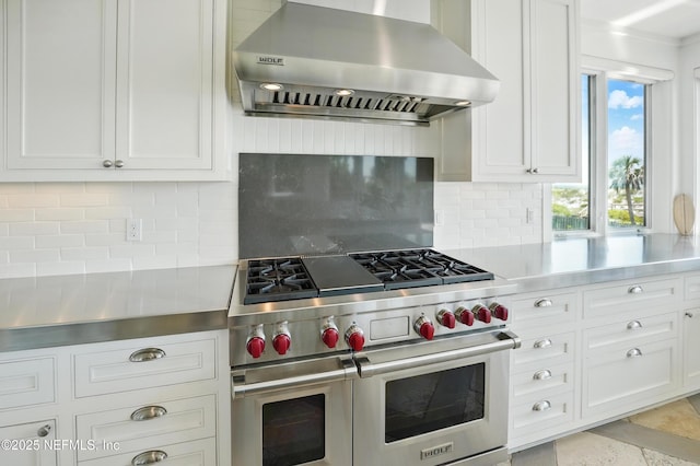 816 Ocean Front, Neptune Beach, FL 32266 - kitchen with range hood, double oven range, light countertops, and white cabinets