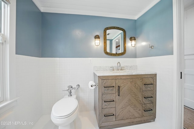 816 Ocean Front, Neptune Beach, FL 32266 - half bath featuring tile walls, vanity, toilet, wainscoting, and crown molding