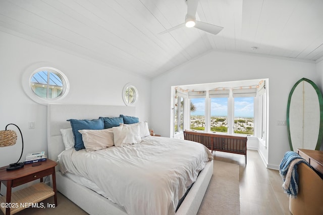 816 Ocean Front, Neptune Beach, FL 32266 - bedroom featuring light wood-style flooring, multiple windows, vaulted ceiling, ceiling fan, and baseboards