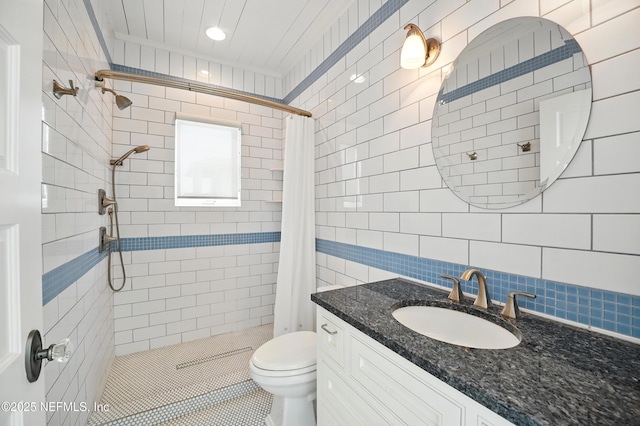 816 Ocean Front, Neptune Beach, FL 32266 - full bathroom featuring tiled shower, toilet, tile walls, vanity, and tile patterned flooring