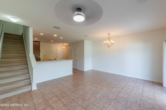 1843 Biscayne Bay Cir, Jacksonville, FL 32218 - unfurnished living room featuring a chandelier, stairway, recessed lighting, and baseboards