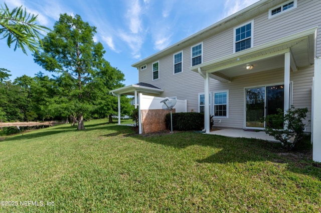 1843 Biscayne Bay Cir, Jacksonville, FL 32218 - rear view of property featuring a lawn and a patio