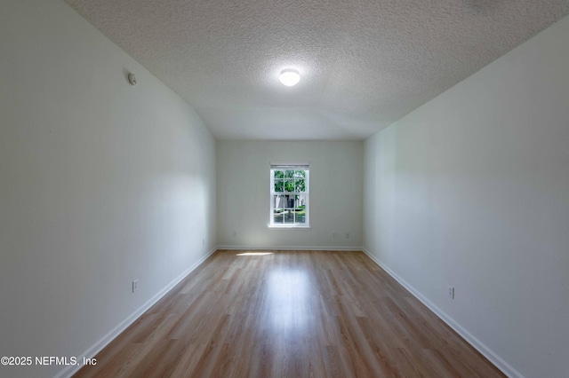 1843 Biscayne Bay Cir, Jacksonville, FL 32218 - unfurnished room featuring wood finished floors, a textured ceiling, and baseboards