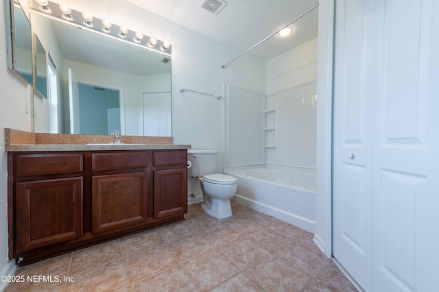 1843 Biscayne Bay Cir, Jacksonville, FL 32218 - bathroom featuring vanity, shower / bath combination, toilet, a textured ceiling, and tile patterned flooring
