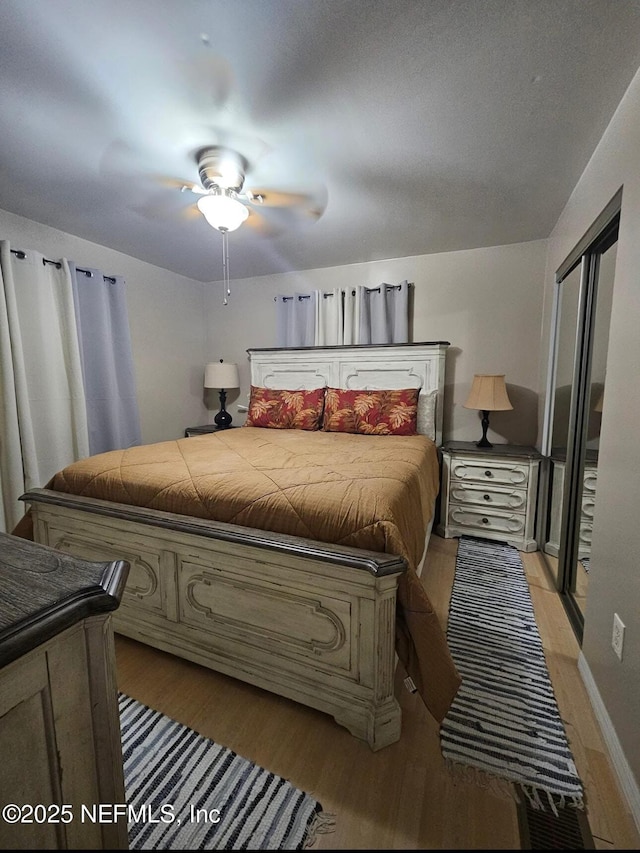 104 Palm Dr, Georgetown, FL 32139 - bedroom with light wood-type flooring, ceiling fan, and baseboards