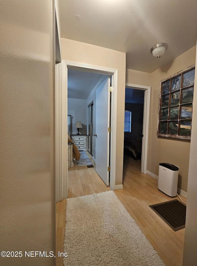 104 Palm Dr, Georgetown, FL 32139 - hall with wood finished floors and baseboards